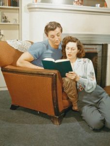 Robert and Dorothy Mitchum, at home around
